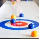 Tisch-Curling Gesellschaftsspiel