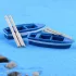 2-teiliges Miniatur-Anglerboot-Set mit Holzrudern, blaue Harz-Bootsfigur