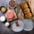 Grauer Metall-Burgerpresse