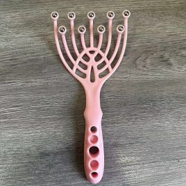 Kopf-Massagegerät und Kratzer